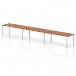 A sleek and modern office setup, this bench desk features a silver frame and a Walnut finish. It comfortably fits three people in a single row, offering a dynamic and collaborative work space.