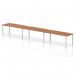 A sleek and modern office setup, this bench desk features a silver frame and a Walnut finish. It comfortably fits three people in a single row, offering a dynamic and collaborative work space.