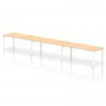 This picture shows a sleek and modern bench desk with a white frame and single row design. The desk has room for three people and is finished with a stylish maple top. It is part of the Dynamic Bench Desking Impulse collection.