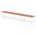 This sleek and modern bench desk features a sleek white frame and a rich walnut table top. It can accommodate up to three people and is perfect for a dynamic and collaborative office environment.