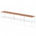 This sleek and modern bench desk features a sleek white frame and a rich walnut table top. It can accommodate up to three people and is perfect for a dynamic and collaborative office environment.