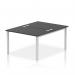 The photo captures a sleek and modern office setup with two dynamic bench desks. The silver frames add a touch of sophistication while the black desks exude professionalism. Its a spacious and functional work area for two people.