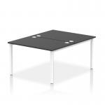 This photograph captures a sleek and modern work space with a dynamic bench desking system. The white frame and black desk provide a clean and stylish look, while the bench desk design allows for efficient use of space. Perfect for a bustling office environment.