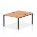 The image shows a modern, sleek bench desk with a black frame and oak top. It is designed for office use and can comfortably accommodate two people. The dynamic design of the bench allows for easy collaboration and productivity.