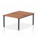 This photo features a sleek, modern bench desk with dynamic design and 2-person capacity. The black frame and walnut finish exude professionalism, making it a great addition to any B2B office space.