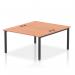 This picture features a sleek and modern bench desk, designed for two people. The black frame adds a touch of elegance, while the beech top provides a warm and inviting charm. This dynamic bench desk is perfect for any B2B office space, with its spacious 1400 size.