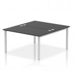 This photo features a dynamic bench desking set-up, known as the Impulse Bench B2B, with a sleek silver frame and black office bench desk. Designed for two people, it measures 1400 in length and offers a modern and functional workspace solution.