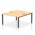 This dynamic bench desking set features a modern black frame and smooth maple surface. It comfortably seats two people and offers a stylish and functional addition to any office space.