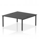 This image features a sleek and modern office bench desk with a black frame and two workstations. The bench is designed for two people and has a length of 1600 millimeters. Its dynamic design makes it perfect for a collaborative work environment.