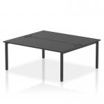 This image shows a sleek and modern office setup with a dynamic bench desking system. The two-person bench desk is 1800mm wide and has a black frame, complemented by a matching black bench top. This versatile and efficient design is perfect for a professional and productive workspace.