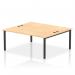 A sleek and modern office space is captured in this picture of the Dynamic Bench Desking Impulse Bench B2B. The 2-person 1800 black frame desk is paired with a maple finish, creating a balanced and professional look. The open design of the bench desk allows for collaboration and productivity in the workplace.