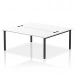 This photo features a dynamic bench desking set, the Impulse Bench B2B, designed for two people with a sleek black frame and a white office bench desk measuring 1800.