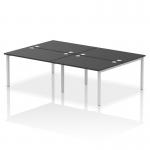 A photo of the Dynamic Bench Desking Impulse Bench B2B shows a sleek, modern office space with four individual workstations arranged in a row. The silver frames of the desks contrast nicely against the black desktops and chairs, creating a professional and dynamic atmosphere.