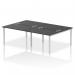 A photo of the Dynamic Bench Desking Impulse Bench B2B shows a sleek, modern office space with four individual workstations arranged in a row. The silver frames of the desks contrast nicely against the black desktops and chairs, creating a professional and dynamic atmosphere.