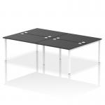 This photograph features a dynamic bench desking set-up, specifically the Impulse Bench B2B model designed for 4 people. The sleek, white frame of the desk is contrasted by a black-colored desktop, creating a modern look for any office space.