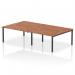 A photo of the Dynamic Bench Desking Impulse Bench B2B 4 Person 1400 with a black frame and walnut top shows a sleek, modern office bench desk. The spacious layout and clean lines create a professional workspace for up to four people. The black frame adds a bold touch, while the walnut top brings warmth to the design.
