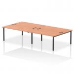 The picture features a sleek and modern office bench desk with a black frame and four workstations, designed for dynamic and collaborative work environments. The desks are made with a sturdy beech wood top and ample space for each person.
