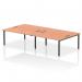 The picture features a sleek and modern office bench desk with a black frame and four workstations, designed for dynamic and collaborative work environments. The desks are made with a sturdy beech wood top and ample space for each person.
