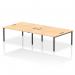 This photo features a dynamic bench desking setup with an Impulse Bench B2B for 4 people. The black frame adds a modern touch to the 1600 bench desk, which is made of sleek maple. Perfect for any office space.
