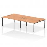 This image depicts a sleek and modern office setup featuring a 4-person dynamic bench desking system. The black frame provides a strong and stylish base, while the oak desk surface adds warmth and elegance to the overall look. The workspace is versatile and functional, perfect for a busy B2B setting.