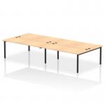 This picture features a modern office space with a dynamic bench desking setup. The sleek black frame and clean lines of the Impulse Bench B2B accommodate four people comfortably, while the Maple finish adds a touch of warmth.