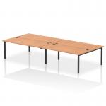 The image features a sleek and modern black-framed bench desk with a spacious 1800mm width. The top is made of oak, giving it a sophisticated touch. With seating for four people, this dynamic bench desking option is perfect for a bustling B2B office environment.