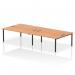 The image features a sleek and modern black-framed bench desk with a spacious 1800mm width. The top is made of oak, giving it a sophisticated touch. With seating for four people, this dynamic bench desking option is perfect for a bustling B2B office environment.