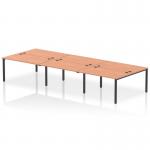 The picture shows a sleek and modern dynamic bench desking setup, with a black frame and a 6 person capacity. The desk is in a beech color, exuding a professional and sleek look for a modern office setting.