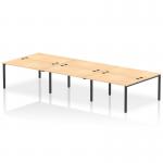 A modern office space is highlighted by the sleek and stylish design of the Dynamic Bench Desking Impulse Bench B2B. Made for 6 people, this bench desk features a black frame and a maple top, creating a balance between elegance and durability for a productive work environment.