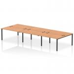 This image features a dynamic bench desking setup with an Impulse Bench B2B that can accommodate up to 6 people. The sleek black frame of the desk contrasts beautifully with the warm oak finish, creating a modern and professional look for any office space.