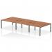 This photograph captures the dynamic look of the Impulse Bench B2B 6 Person Desk, featuring a sleek black frame and beautiful walnut finish. The spacious design provides ample workspace for a productive office environment.