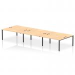 This picture features a sleek and modern dynamic bench desking set-up: the Impulse Bench B2B 6 person desk with a black frame and a maple finish. This functional and stylish office bench desk is perfect for any professional setting.