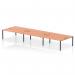 The image shows a modern and functional office setup with a sleek and spacious bench desk that features a 6 person capacity. The desk has a black frame and a warm beech finish, creating a professional yet inviting atmosphere. This dynamic bench desking system is perfect for any bustling workplace.
