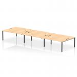 This picture features a 6-person dynamic bench desking setup from Impulse Bench B2B, with a sleek black frame and a maple office bench desk. The design is ideal for collaborative workspaces and promotes a modern and professional atmosphere.
