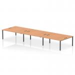 The dynamic bench desking Impulse Bench B2B can comfortably fit 6 persons. It has a sleek black frame and a sturdy oak desk, providing a professional look for any office space.