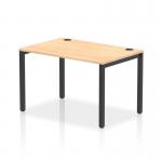 A sleek and modern office space with a single row of dynamic bench desking. The black frame and maple desk add a touch of elegance, while the 1200 width provides ample workspace. Perfect for a collaborative and efficient work environment.