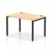 A sleek and modern office space with a single row of dynamic bench desking. The black frame and maple desk add a touch of elegance, while the 1200 width provides ample workspace. Perfect for a collaborative and efficient work environment.