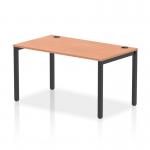 This picture showcases a sleek and modern dynamic bench desking system with a single row of benches. The black frame adds a touch of sophistication to the overall design, while the office bench desk features a beautiful beech finish. Truly a stunning and functional addition to any workspace.