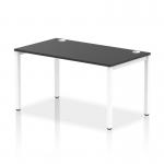 The photograph features a sleek, modern Dynamic Bench Desking Impulse Bench with a single row and 1400 width. The frame is white and the desk itself is black, creating a stylish contrast. This office bench desk is both functional and visually appealing for any workspace.
