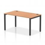 The Dynamic Bench Desking Impulse Bench Single Row 1400 features a sleek black frame and a spacious oak desk, creating a modern and professional look. Its dynamic design allows for increased productivity in the office, making it a versatile option for any workspace.