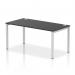 The photo shows a sleek and modern single row office bench desk with a silver frame and black surface. The design is dynamic, perfect for a collaborative workspace.