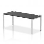 This photo shows a sleek and modern dynamic bench desking setup. The silver frame adds a touch of elegance to the sturdy black office bench desk. Perfect for collaborative workspaces and open offices.