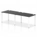 The photograph captures a sleek and modern Dynamic Bench Desking Impulse Bench. The single row design accommodates 2 people comfortably, with a white frame and black desk, making it perfect for any modern office space.