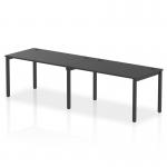 This image features a sleek and modern office bench desk with a black frame. It is designed for dynamic and collaborative work, with a single row and seating for two people. The 1400 size makes it ideal for small spaces.