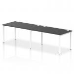 This photograph captures a sleek and modern dynamic bench desking setup. The Impulse Bench features a single row of seating for two people, with a stylish white frame and a striking black office bench desk. The clean and minimalist design exudes professionalism and efficiency.