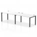 The photo shows a modern, stylish bench desk with a black frame and white tabletop. Two people can work comfortably side by side on this sleek and functional piece of office furniture.
