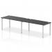 The photo captures a sleek and modern workplace setting with a row of dynamic bench desks. The silver frame adds a touch of sophistication while the black bench top offers a clean and professional look. Perfect for any office in need of functional and stylish workstations.