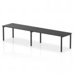 This image features a sleek, modern Dynamic Bench Desking Impulse Bench. It has a black frame and can seat two people in a single row. The desk itself is 1800mm long and is perfect for any office setting.
