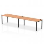 The Dynamic Bench Desking Impulse Bench has a sleek and modern design with a black frame and a beautiful oak desk. Its single row setup comfortably accommodates two people, making it ideal for any office space.