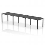 The image shows a sleek and modern desk with a black frame and three seats in a single row. The desk is designed for office use and features a dynamic bench desking style, making it perfect for collaborative work environments.